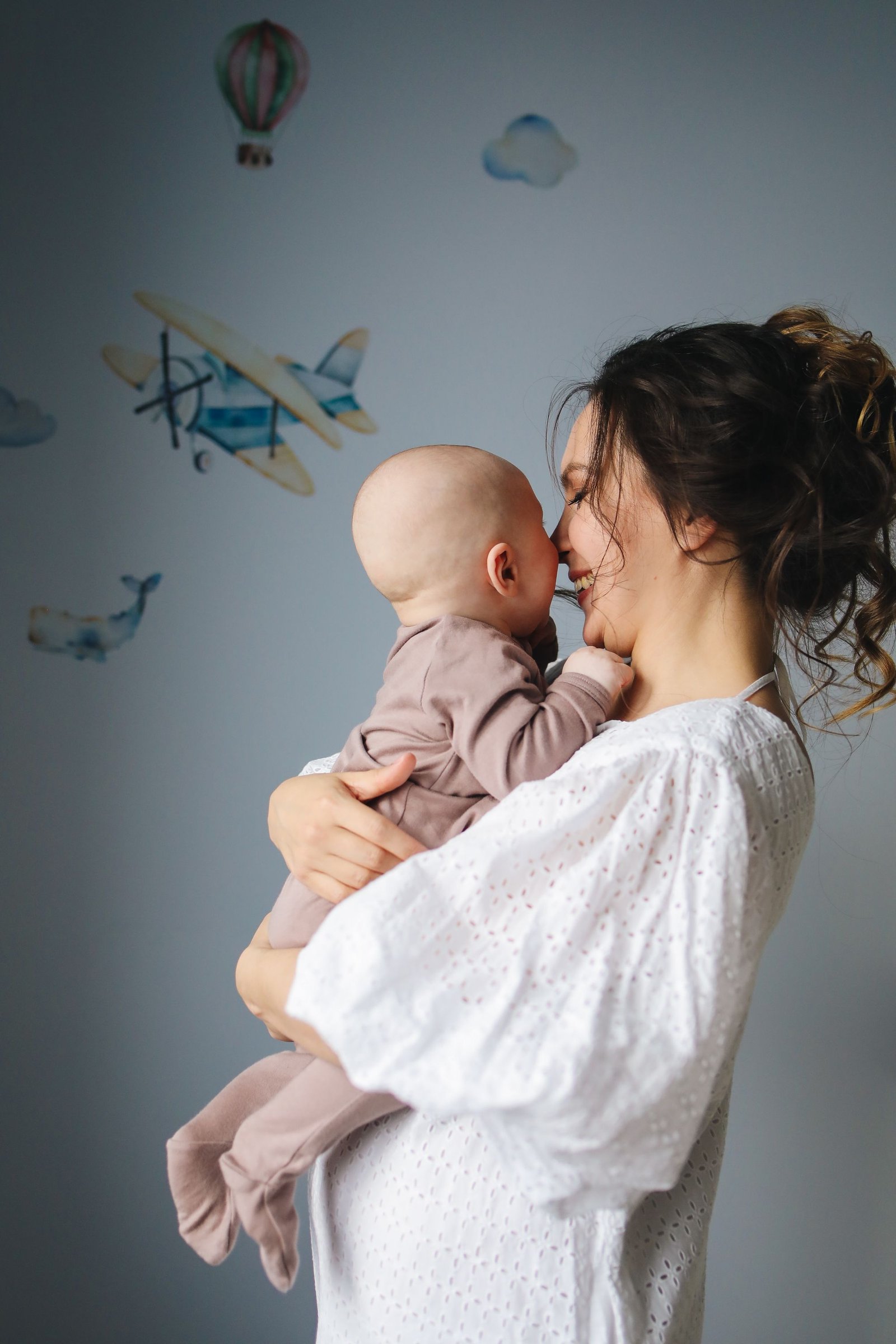 A mother lovingly holding her baby — a Serenity success story